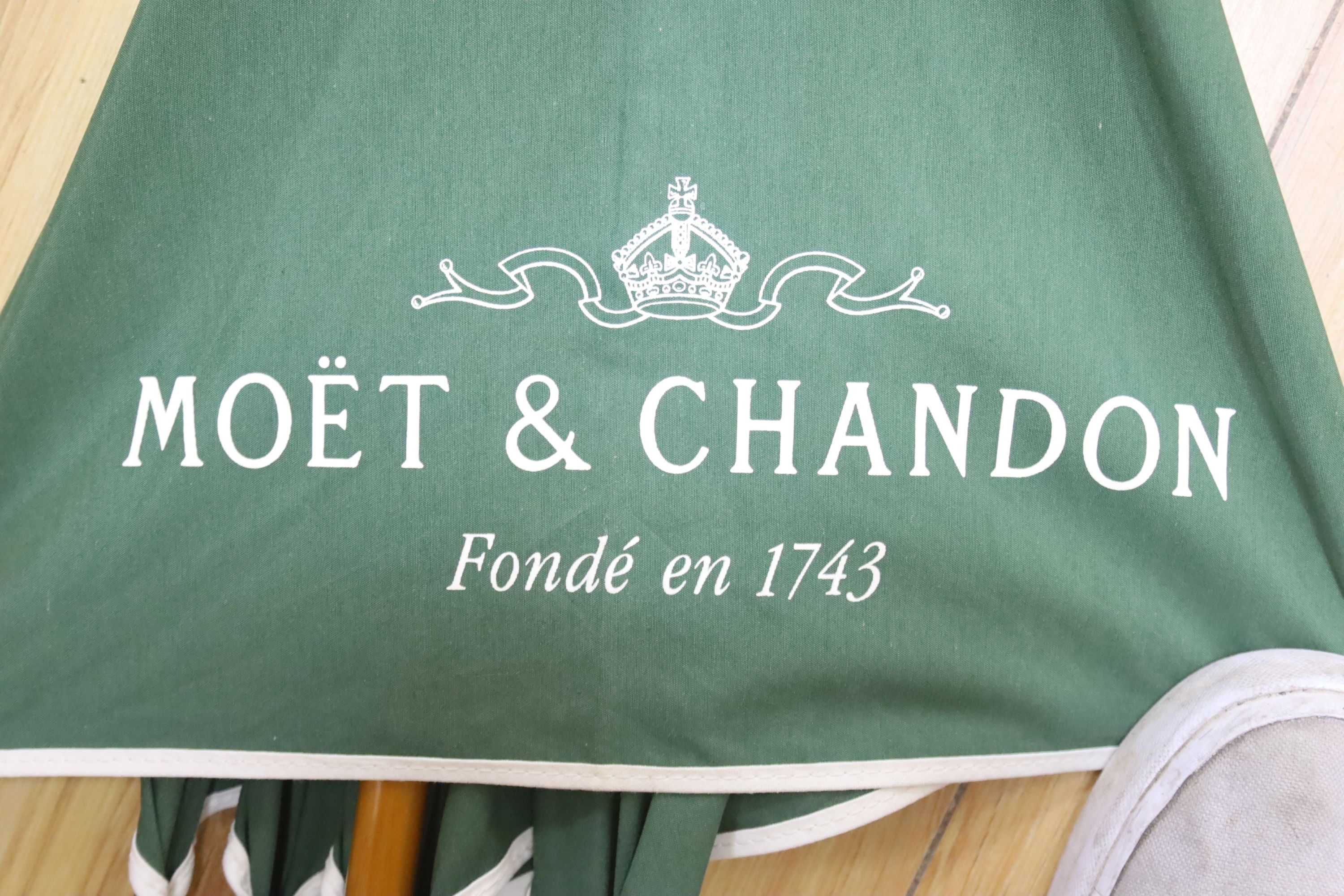 A Moet & Chandon umbrella, length 96cm